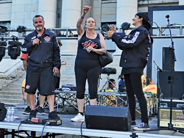 A group of people standing on top of a stage.